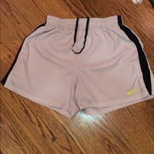 White Nike running shorts